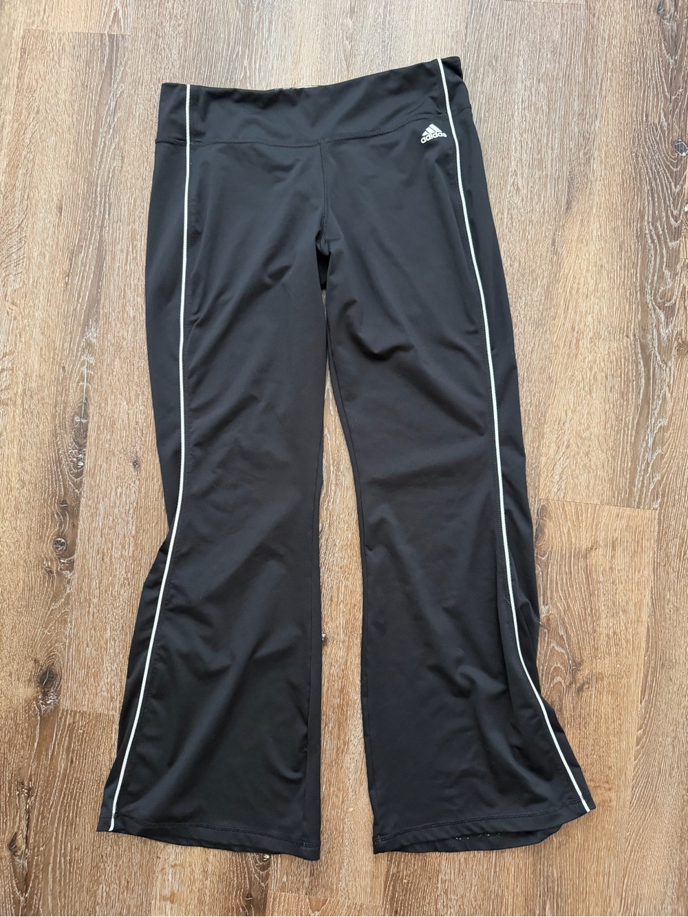 adidas women’s black athletic pants with White Piping.